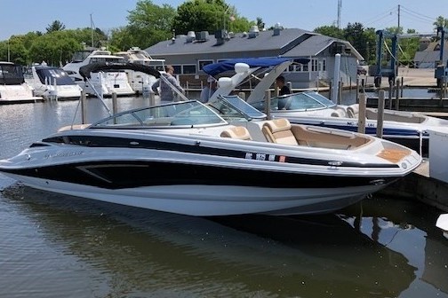 a boat is docked next to a body of water