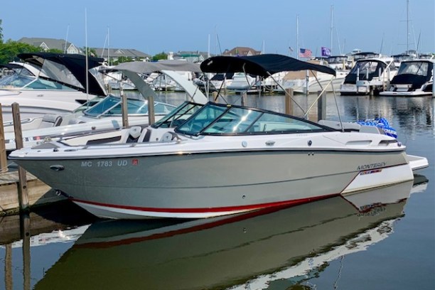 a boat is docked next to a body of water